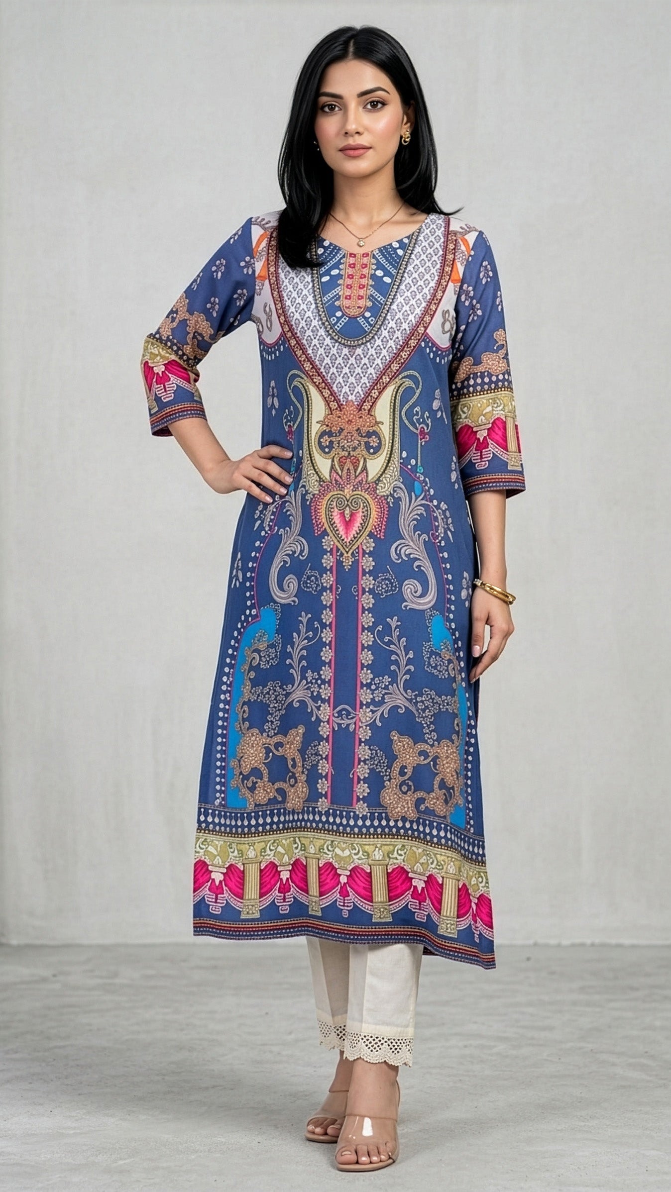 Woman wearing a colorful patterned kurta against a plain background