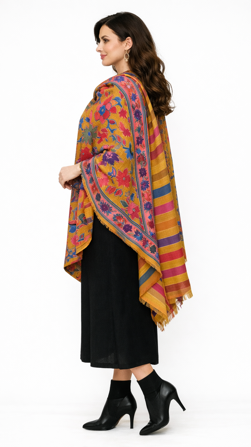 Woman wearing a colorful floral-patterned shawl on a white background