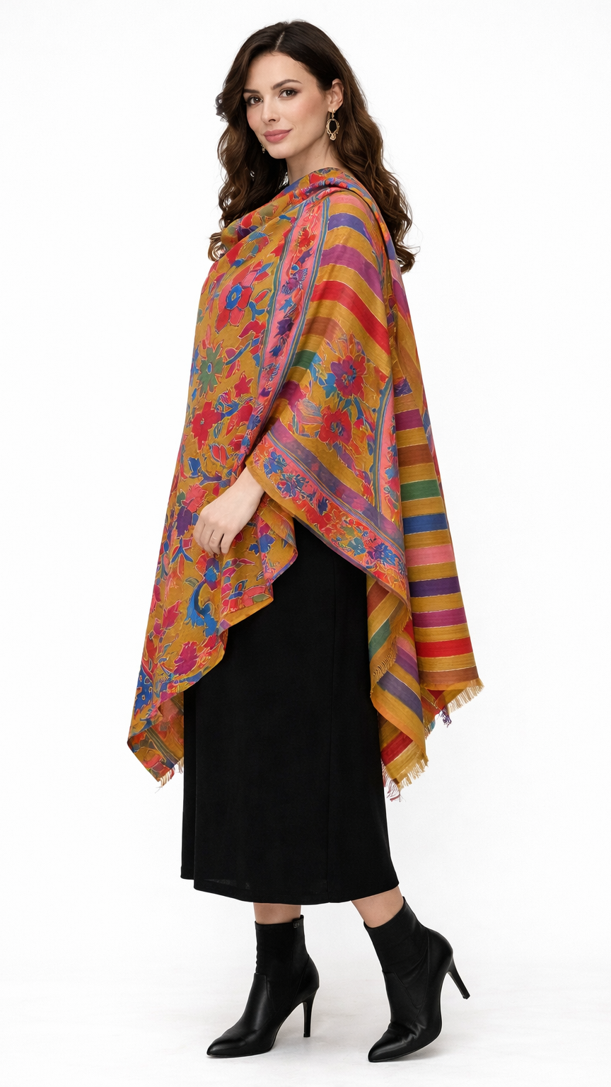 Woman wearing a colorful floral and striped shawl on a white background