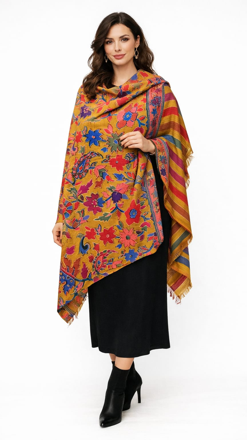 Woman wearing a colorful floral patterned shawl on a white background