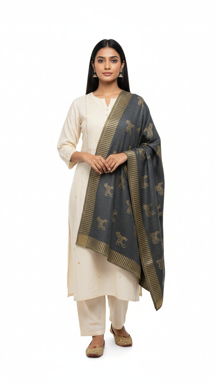 Woman wearing a white kurta with a dark blue dupatta featuring gold patterns on a white background
