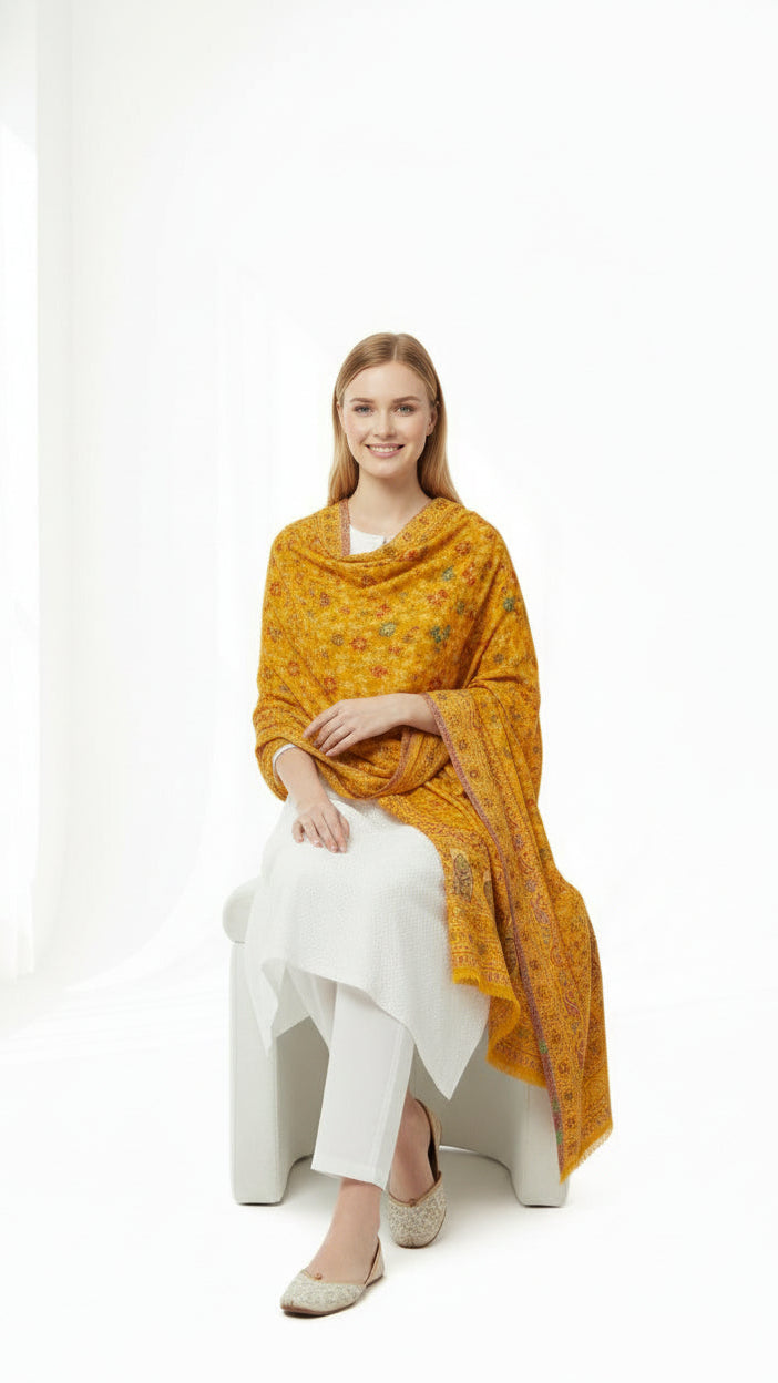 Woman wearing a mustard yellow traditional outfit with a white background