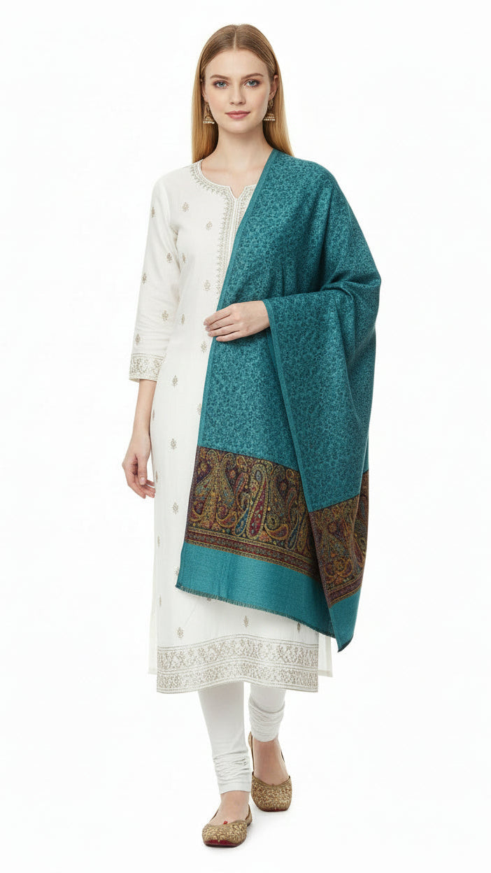 Woman wearing a white kurta with a blue dupatta on a white background